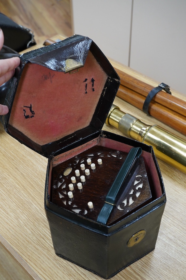 A leather cased mid-19th century Lachenal, London, 23 button concertina. Condition - fair to good, some wear to the case. The bellows appear sound and strong.